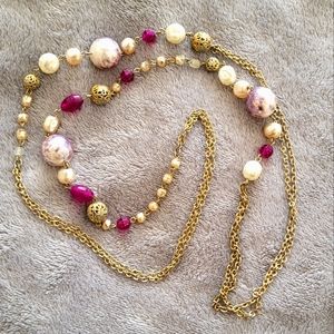 Long purple bead and silver tone necklace